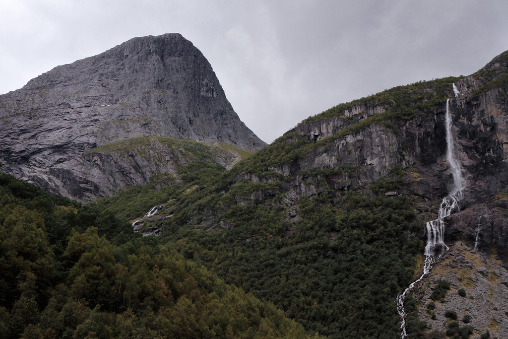When the glacier melts, cascade thunder down the mountainsides in Briksdalen valley.